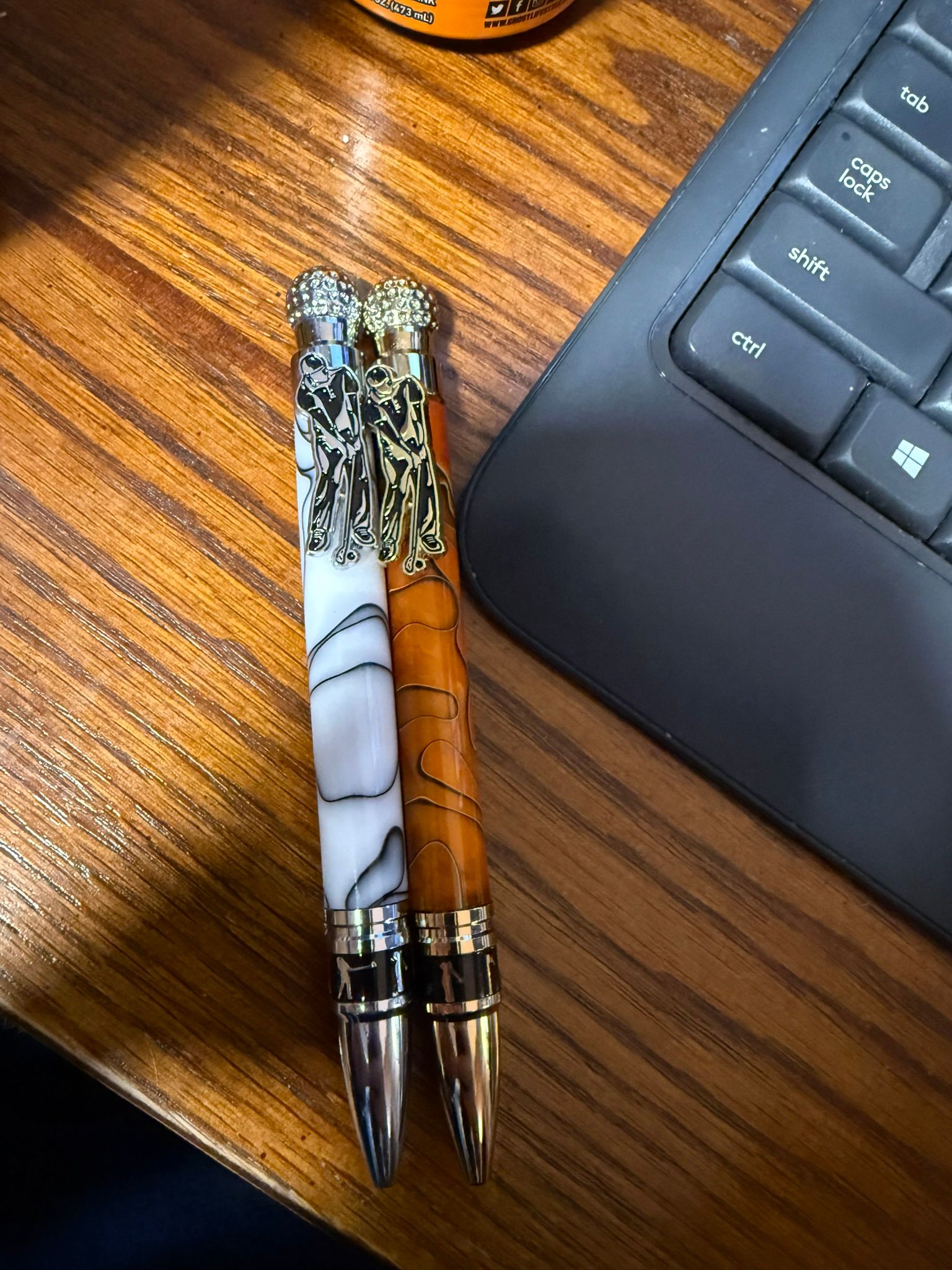 Handcrafted wood and resin pens with ornate metal fittings