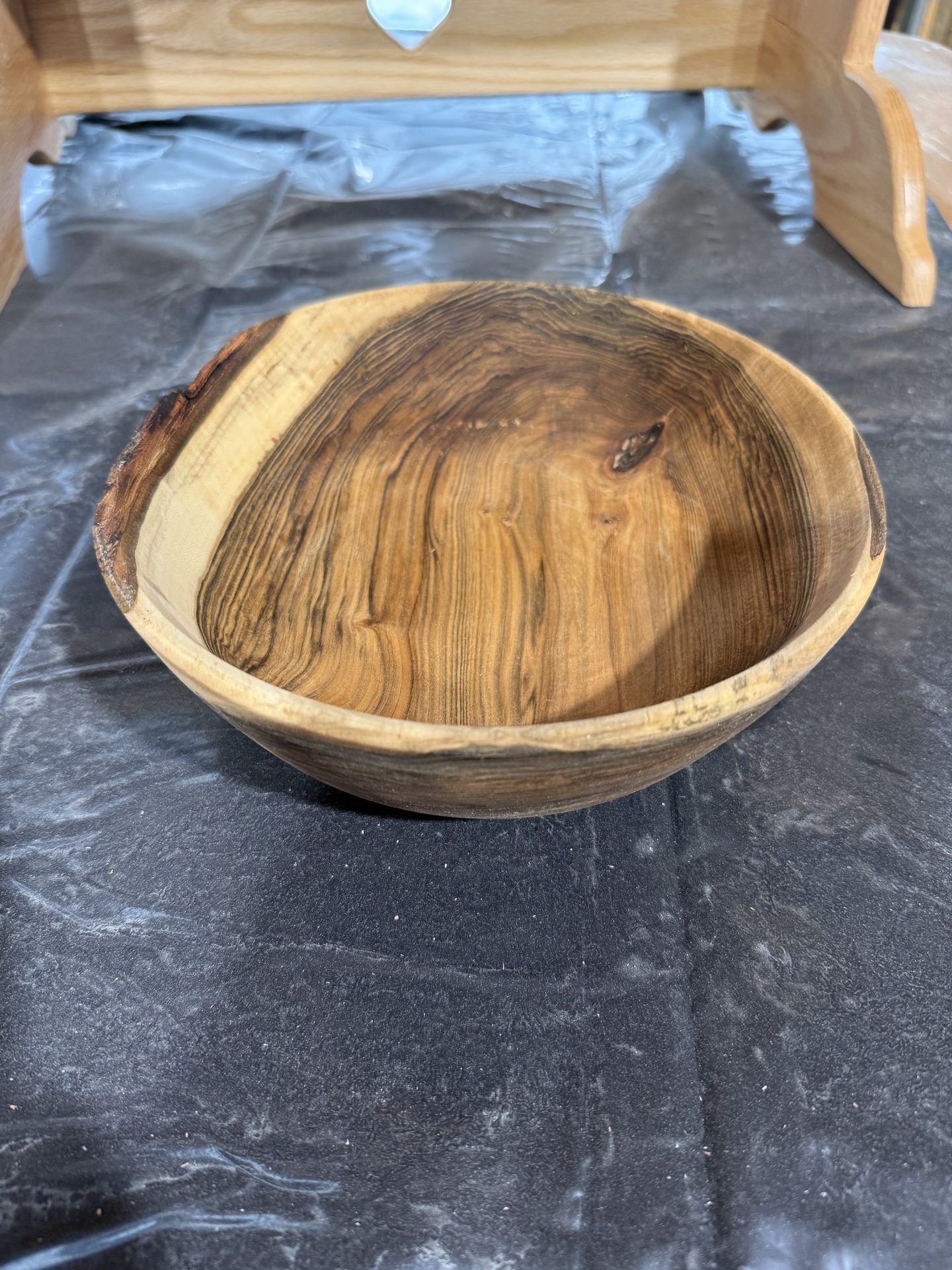 Hand-turned walnut bowl with natural edge and dramatic grain